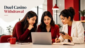 Three young Indian women in a modern red-themed workspace reviewing a laptop and phone for a Duel Casino Withdrawal guide.