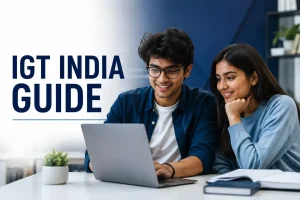 Two young Indian adults using a laptop together in a modern office, with “IGT India Guide” text on the left.